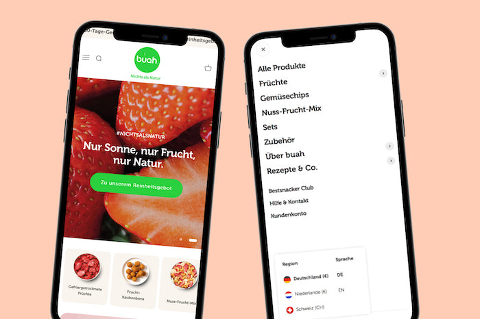 Zwei Smartphones zeigen Buah-Webseite links mit großem Erdbeermotiv und Slogan Nur Sonne nur Frucht rechts Menü mit Produktkategorien